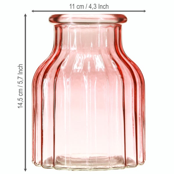 Glasvase in Rosa mit geriffelter Struktur, Höhe 14,5 Zentimeter, Durchmesser oben 11 Zentimeter.