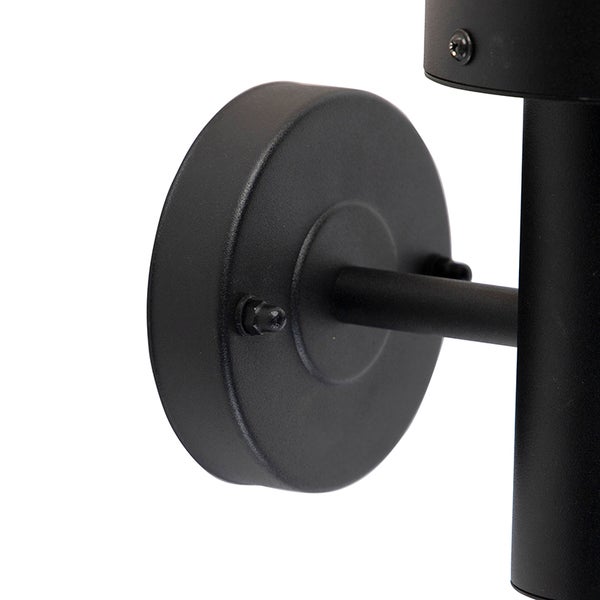 Zylindrische Außenwandleuchte aus schwarzem Metall mit klarem Glasschirm, sichtbarem Leuchtmittel und Bewegungsmelder.
