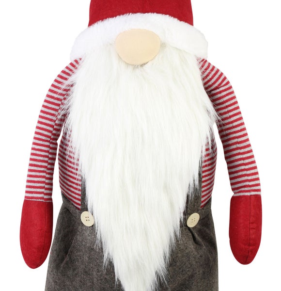 Weihnachtswichtel mit gestreiftem Hemd, Bart und Mütze