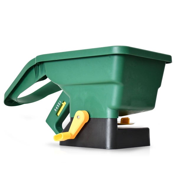 Grüner Handstreuer aus Kunststoff mit schwarzem Fuß und gelber Kurbel für Dünger, Saatgut und Streusalz.
