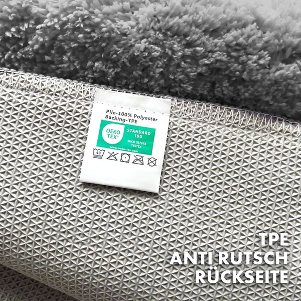 Detailansicht eines Teppichs mit Öko-Tex Standard 100 Siegel und TPE-Antirutsch-Rückseite.
