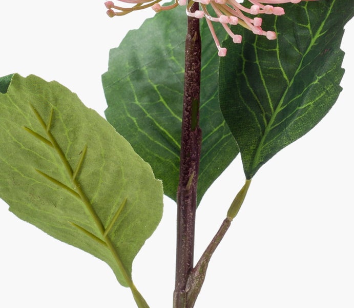 Nahaufnahme eines künstlichen Pflanzenstiels mit grünen Blättern und rosa Knospen.