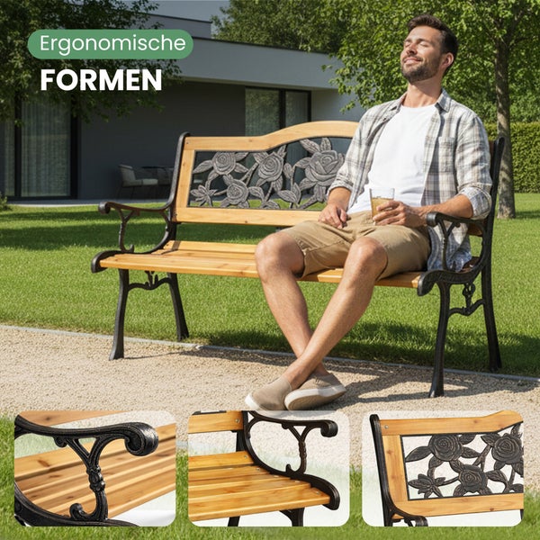 Gartenbank aus Holz und Gusseisen mit ergonomischer Form und dekorativem Rosenmuster in der Rückenlehne im sonnigen Garten.