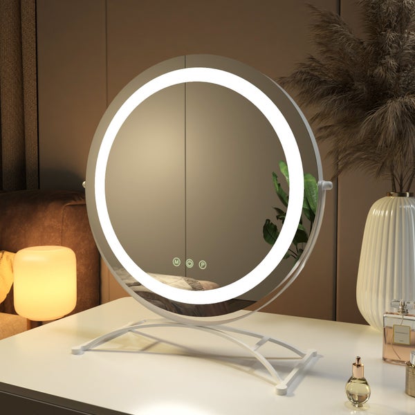 Runder Kosmetikspiegel mit LED-Beleuchtung auf einem weißen Tisch