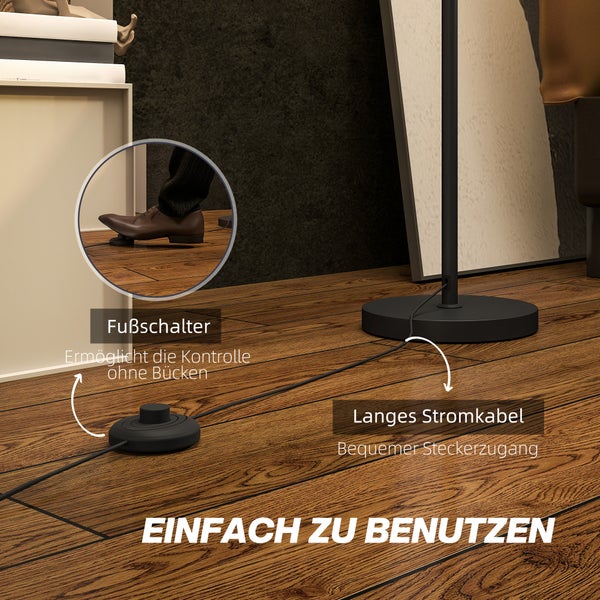 Detailaufnahme eines Fußschalters und des langen Stromkabels einer Stehlampe auf einem Holzboden
