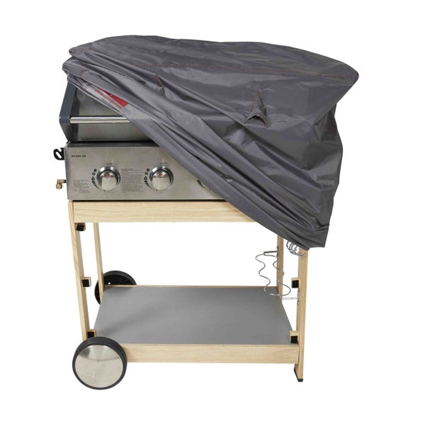 Gasgrill mit vier Brennern auf einem Holzwagen mit Rollen, teilweise mit einer Schutzhülle mit Covup Logo abgedeckt.
