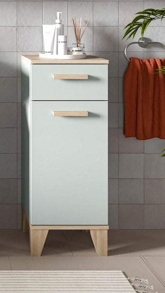 Hoher Badschrank mit einer Schublade und einer Tür, Holzoptik Details, stehend auf vier Beinen in einem modernen Badezimmer.