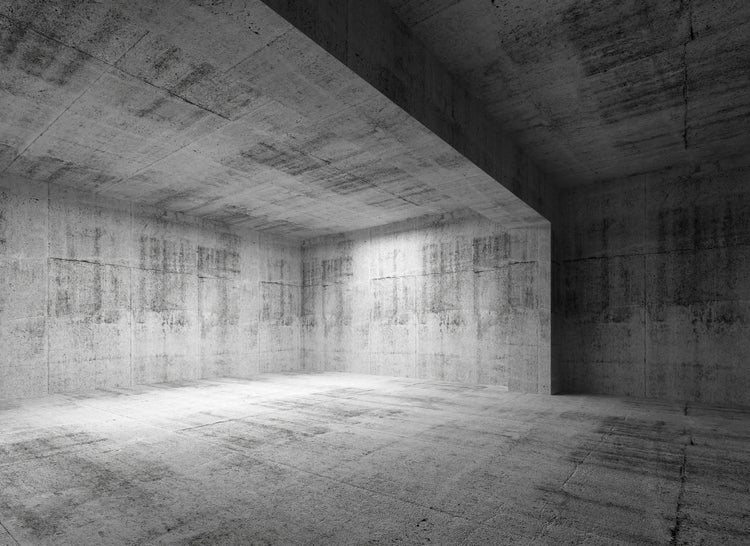 Leerer Raum in industriellem Design mit Wänden, Boden und Decke aus Beton.