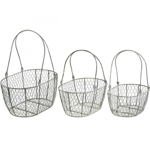 Drei Drahtkörbe unterschiedlicher Größe mit Henkeln