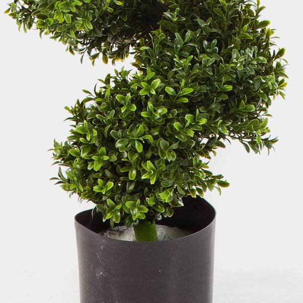 Künstliche Blume Skimmia mit weißen Blüten und grünen Blättern.