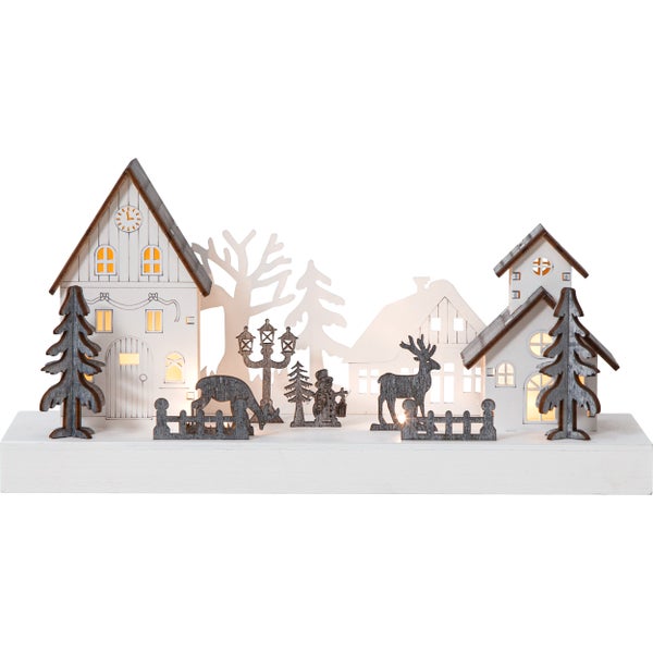 Weihnachtliche Holzdekoration mit Häusern, Bäumen und Tierfiguren