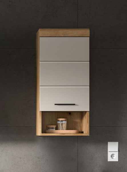 Wandhängender Badezimmerschrank in Eichenoptik mit grauer Front, einem Türfach mit schwarzem Griff und einem offenen Ablagefach unten.