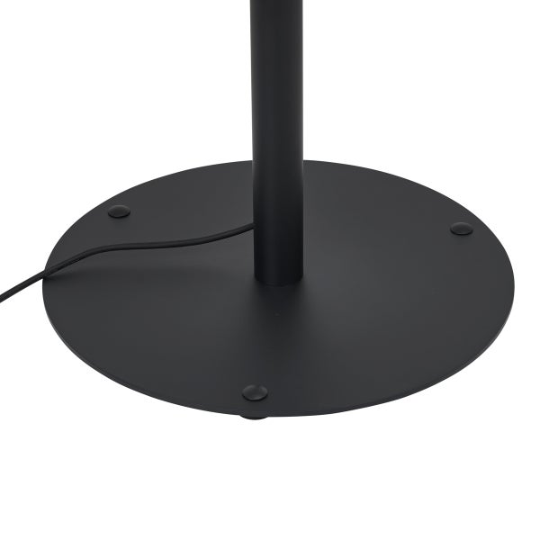 Runder, schwarzer Lampenfuß aus Metall mit zentralem Standrohr und schwarzem Kabel.