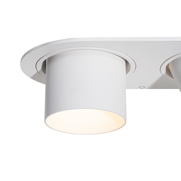 Zylindrischer Deckenspot in Weiß mit warmweißem Licht und matt strukturierter Oberfläche.