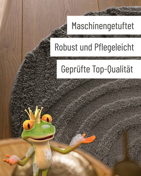 Graue, maschinengetuftete Badematte auf Holzboden mit Froschfigur. Eigenschaften: robust, pflegeleicht und geprüfte Top-Qualität.