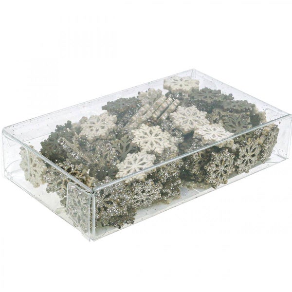 Schachtel mit Deko-Schneeflocken für Weihnachten