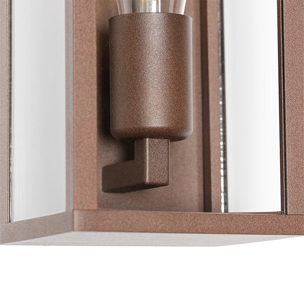 Detailansicht einer Lampenfassung einer Außenwandleuchte aus strukturiertem, rostfarbenem Metall mit Glaseinsätzen.