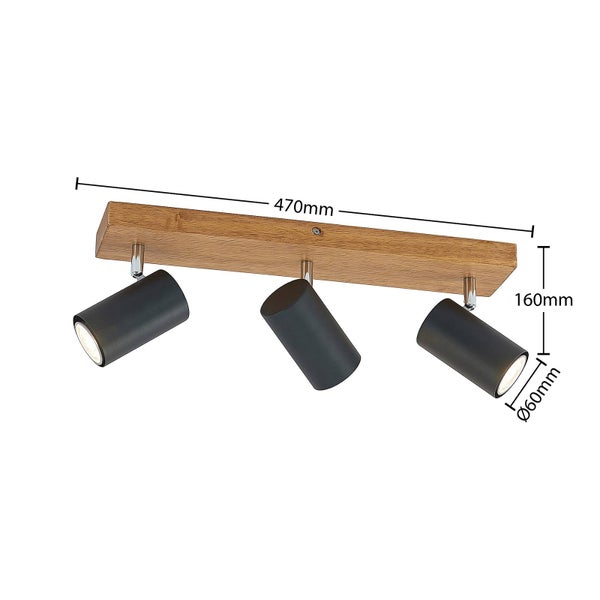 Zimmerpflanze in einem schwarzen Pflanzgefäß mit zwei leeren Pflanzgefäßen