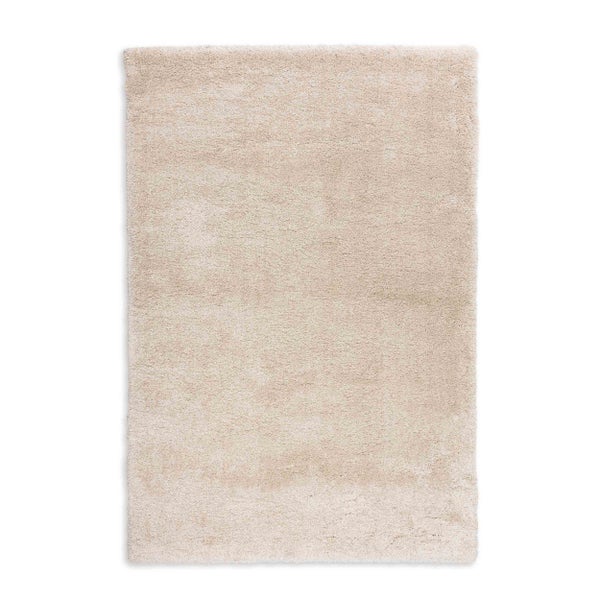 Hochflor-Teppich in Beige, rechteckig, weiche Struktur.