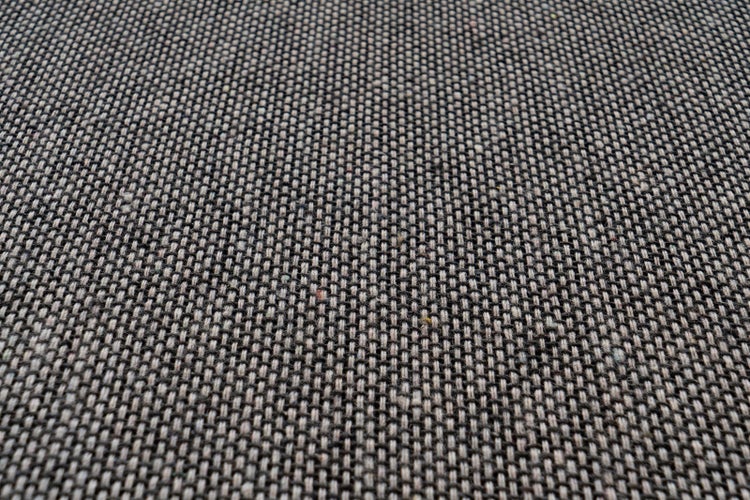 Nahaufnahme einer gewebten Stoffstruktur für Polstermöbel oder Kissen.