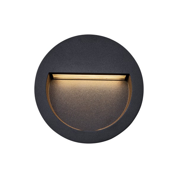 Runde schwarze LED Wandeinbauleuchte für den Außenbereich mit warmweißem Licht.