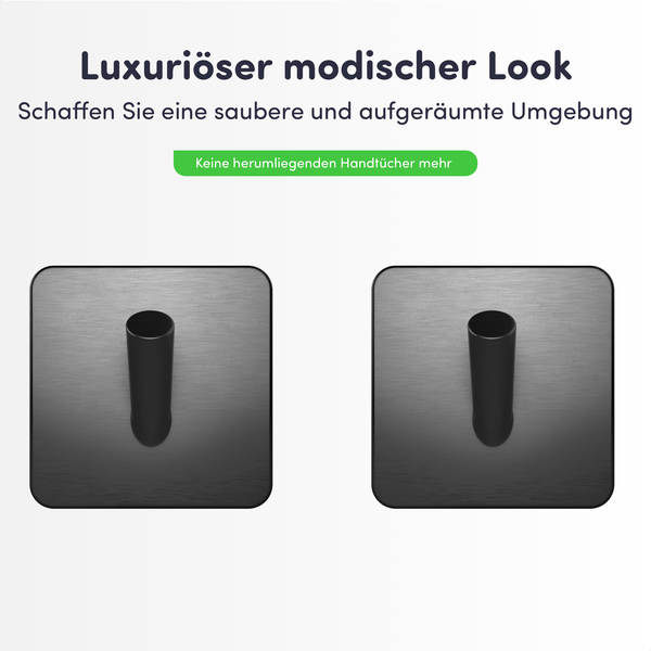 Zwei schwarze Wandhaken mit quadratischer Grundplatte aus gebürstetem Metall für Handtücher.