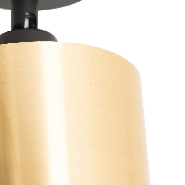 Nahaufnahme einer Deckenleuchte mit zylindrischem Lampenschirm.