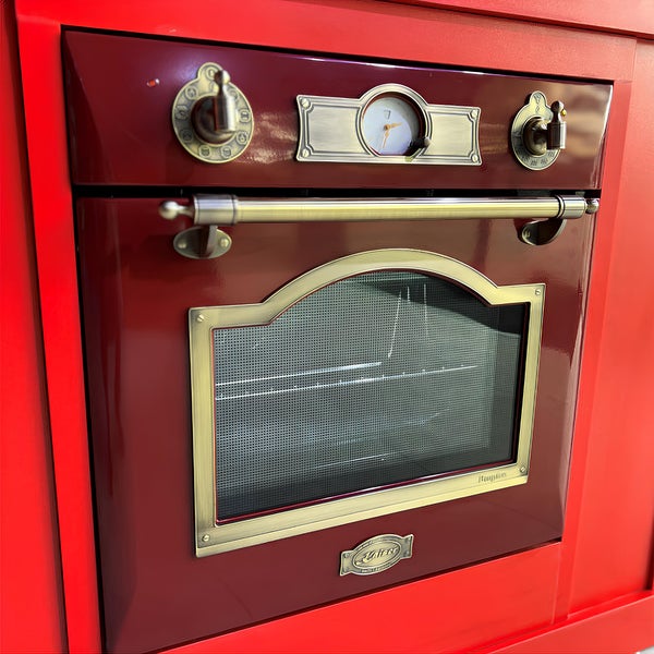 Einbau Backofen im Retro Design mit Kaiser Logo und bronzefarbenen Bedienelementen sowie analoger Uhranzeige.