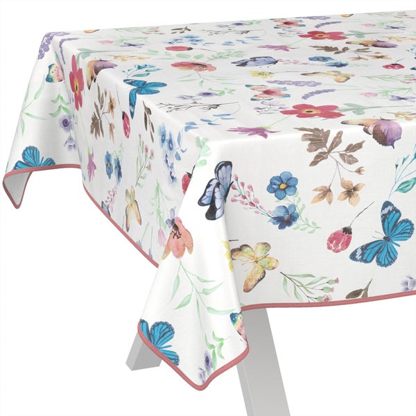 Tischdecke mit buntem Blumen- und Schmetterlingsmuster im Aquarell-Stil.