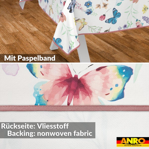 Tischdecke mit Schmetterlings- und Blumenmuster, Paspelband und Vliesstoff-Rückseite. ANRO Logo.