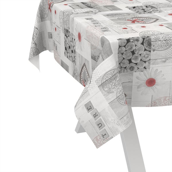 Tischdecke mit Holzoptik, Herzen und Blumenmuster auf einem Tisch
