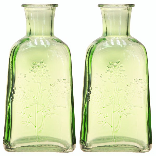 Zwei grüne Glasflaschen mit Blumenmuster