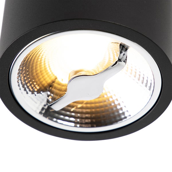 Zylindrischer LED-Strahler in Schwarz, Detailansicht des Leuchtmittels und des strukturierten Reflektors.