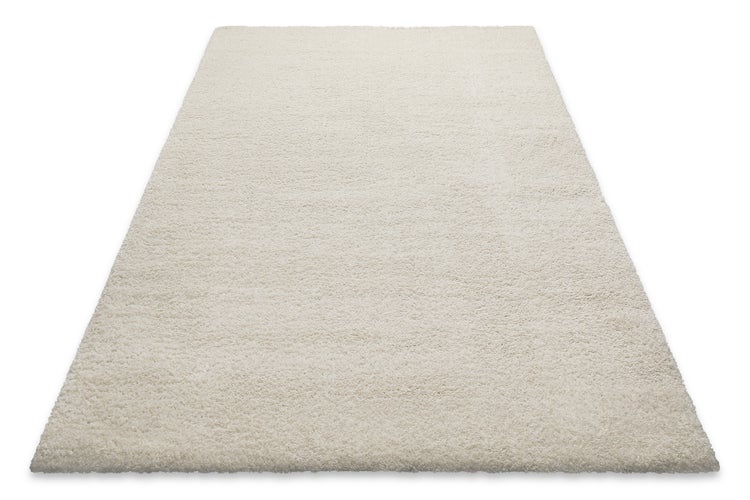 Hochflor-Teppich Shaggy in Cremeweiß, rechteckig, weiche Textur.