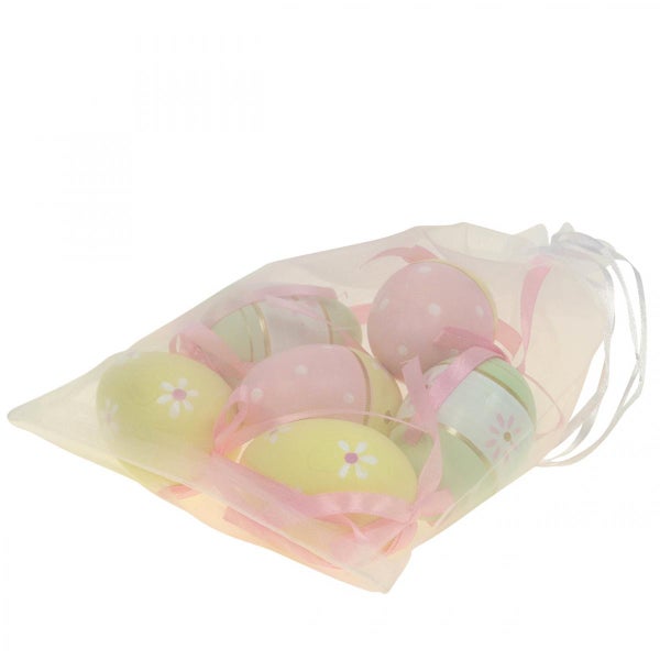 Dekorative Ostereier im Beutel mit Schleifen