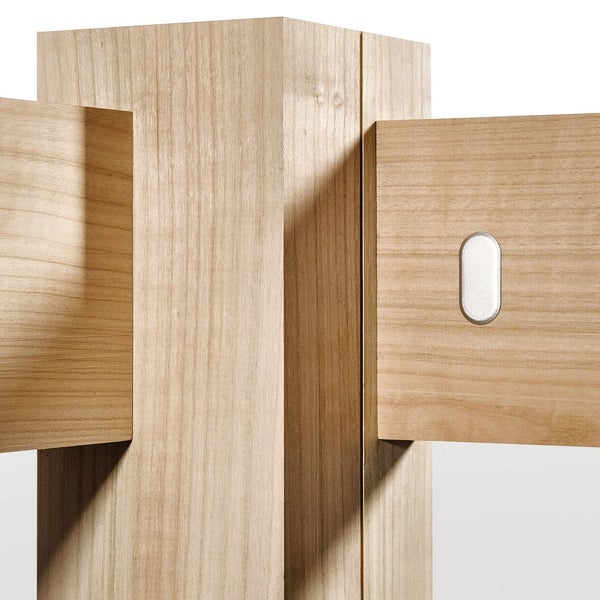 Detailansicht eines Holzmöbels mit rechteckigen Formen und einer ovalen Vertiefung