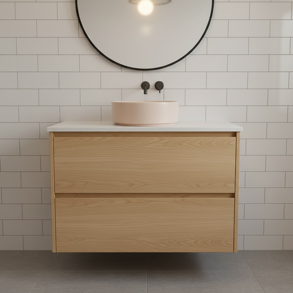 Moderner Waschtischunterschrank aus Holz mit zwei Schubladen, weißer Platte, rundem Aufsatzbecken, schwarzer Wandarmatur und rundem Spiegel.