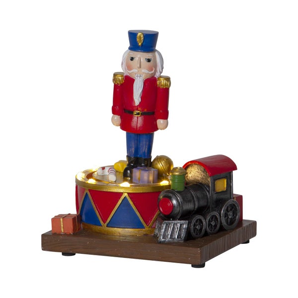 Dekorative Nussknacker Figur mit Spielzeugzug auf Holzsockel