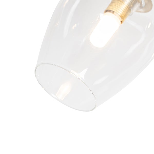 Nahaufnahme einer klaren Glaspendelleuchte mit leuchtender Glühbirne