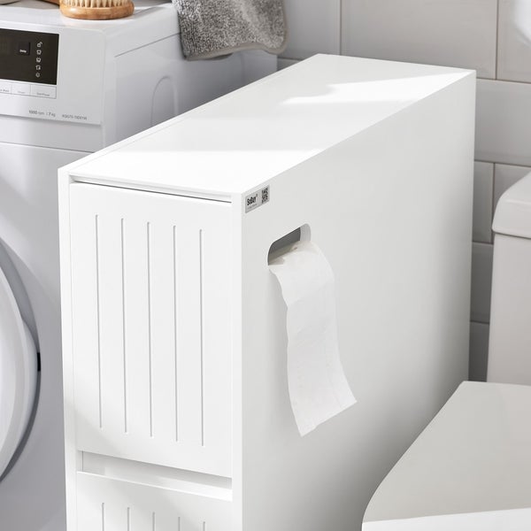 Weißer Badezimmerschrank mit Toilettenpapierhalter neben einer Waschmaschine und einer Toilette
