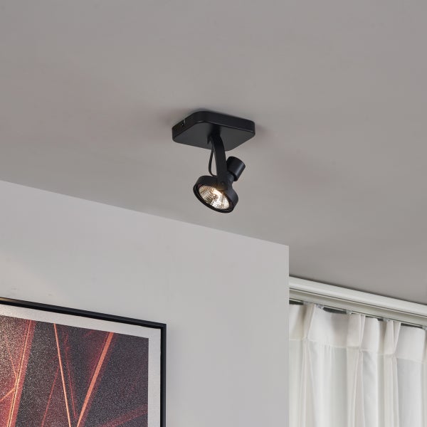 Schwarzer Deckenstrahler mit einem Lichtpunkt