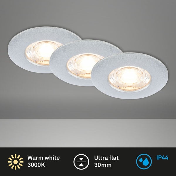 Drei runde, flache Einbaustrahler mit warmweissem Licht