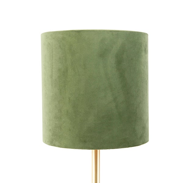 Zylindrischer Lampenschirm aus grünem Samt auf einem goldfarbenen Lampenfuß.