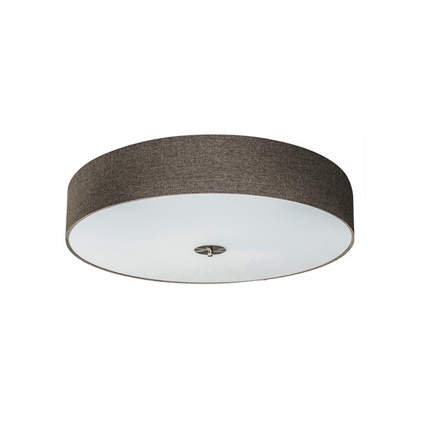 Stehlampe mit schwarzem Metallgestell, rundem Standfuß und bernsteinfarbenem Glasschirm mit Rillenstruktur und Fußschalter.