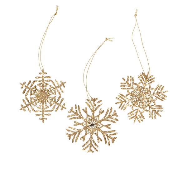 Drei goldfarbene Schneeflocken als Weihnachtsbaumschmuck