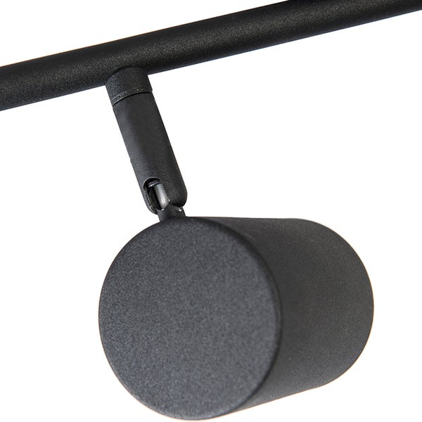 Schwarzer Strahler an einer Schiene für die Deckenbeleuchtung