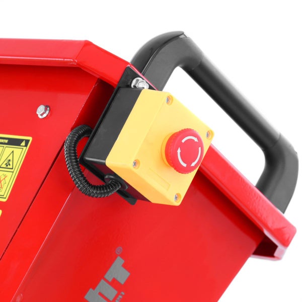 Nahaufnahme einer roten Maschine mit schwarzem Handgriff und einem gelben Gehäuse mit rotem Not-Aus-Schalter.