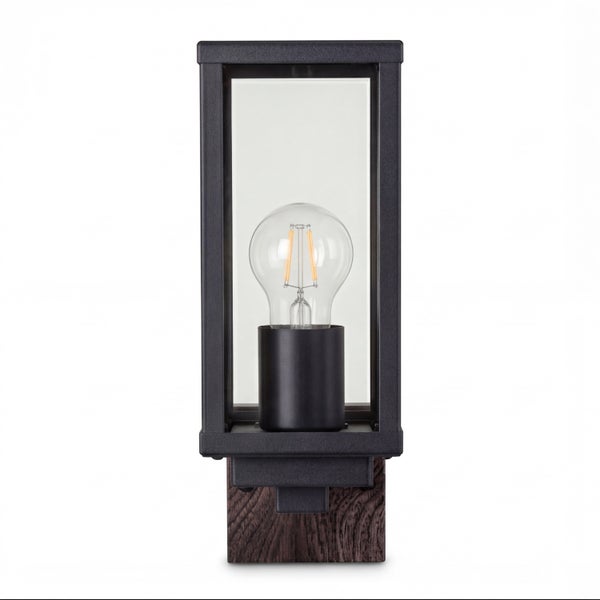 Rechteckige Außenwandleuchte aus schwarzem Metall und Glas mit Holzsockel und sichtbarem Filament-Leuchtmittel.