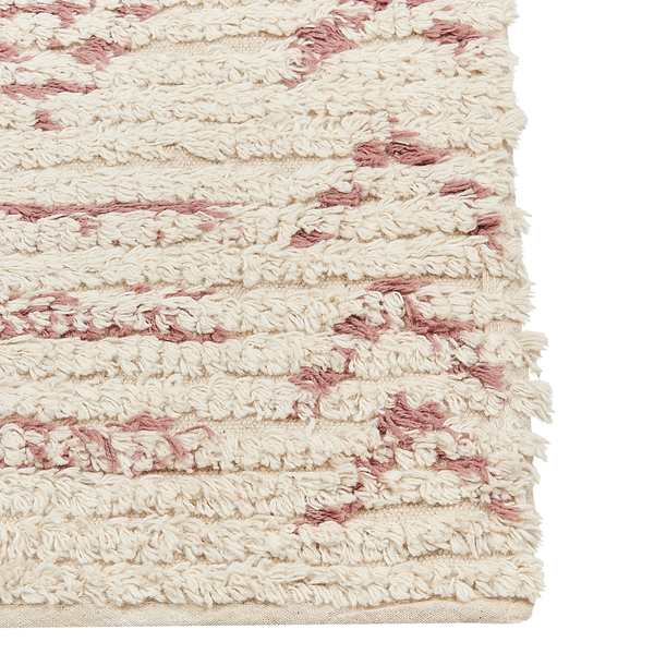 Hochflor-Teppich in Cremeweiß mit rosa-rotem abstrakten Linienmuster und weicher Textur.