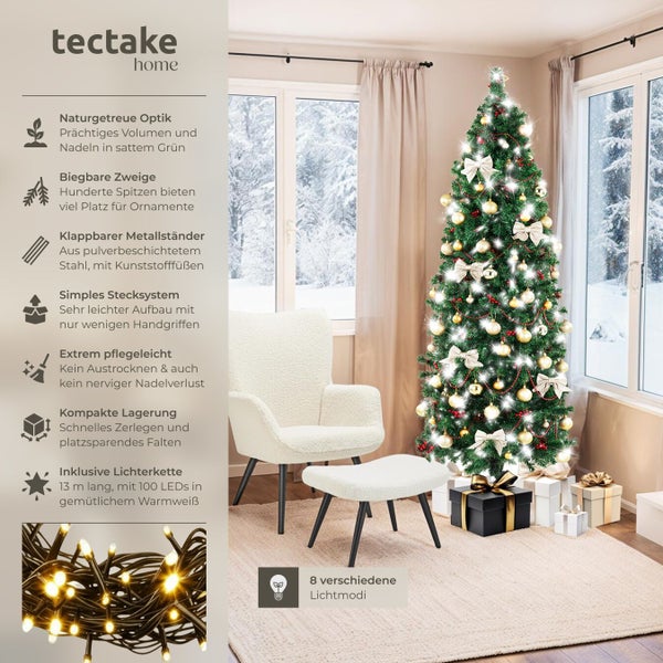 Dekorierter künstlicher Weihnachtsbaum von tectake mit Geschenken, Sessel und Fußhocker in einem Wohnzimmer.
